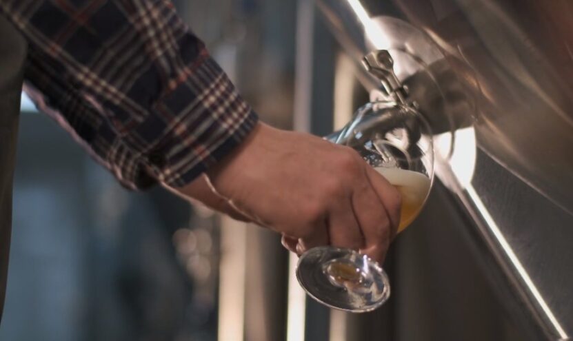 a man pours beer